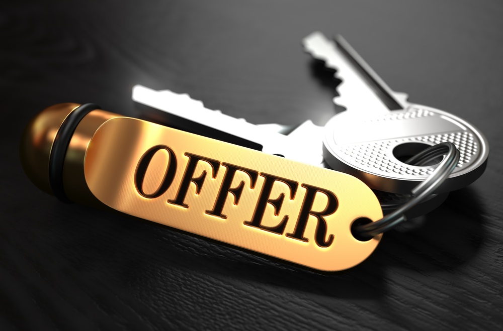 Keys with Word Offer on Golden Label over Black Wooden Background. Closeup View, Selective Focus, 3D Render.